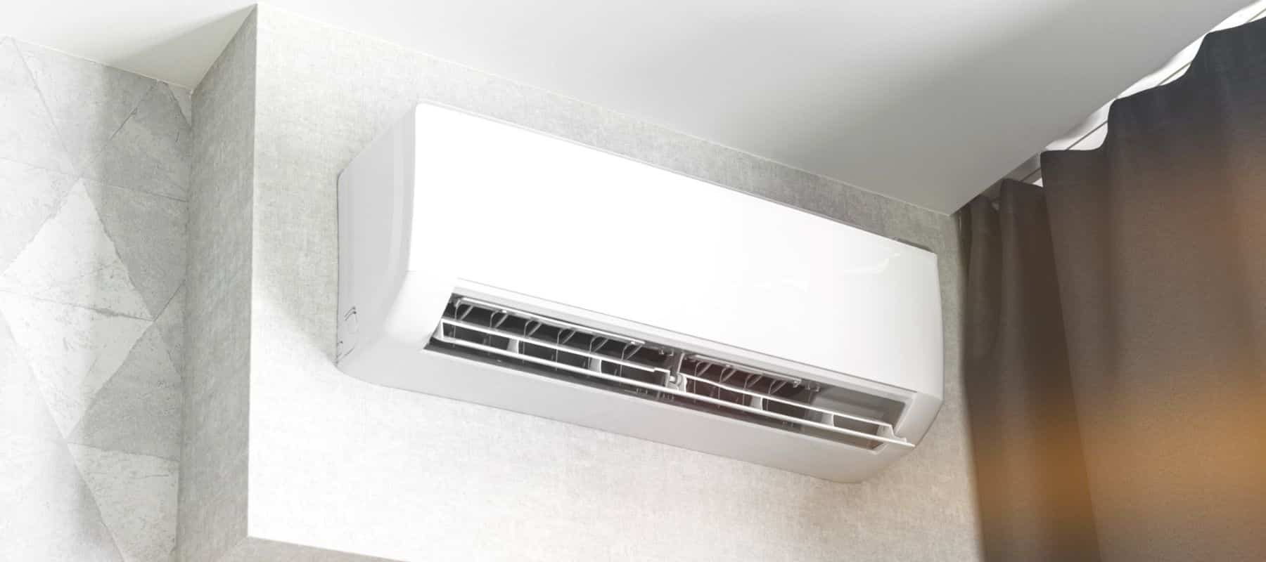 ductless ac unit positioned on the wall in a residential home