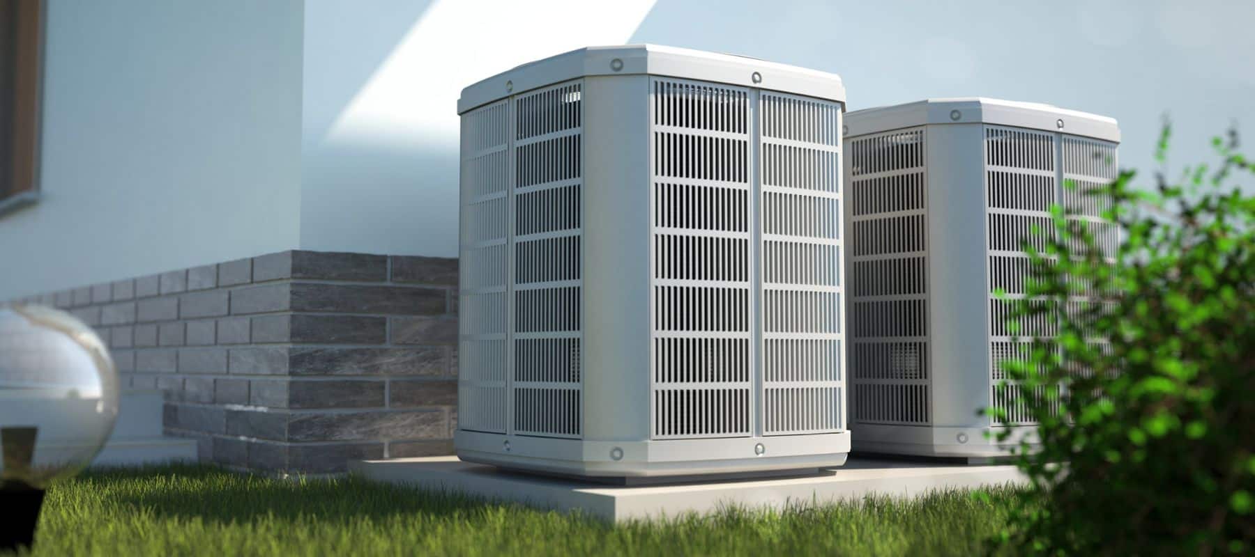 outdoor heat pump unit positioned on the outside of a residential home