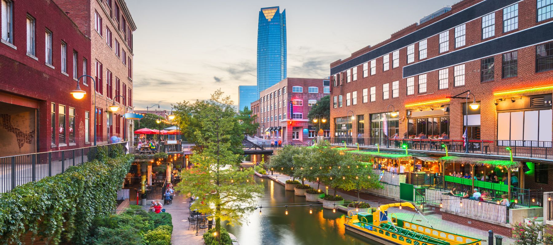 downtown oklahoma city bricktown with river and night lights