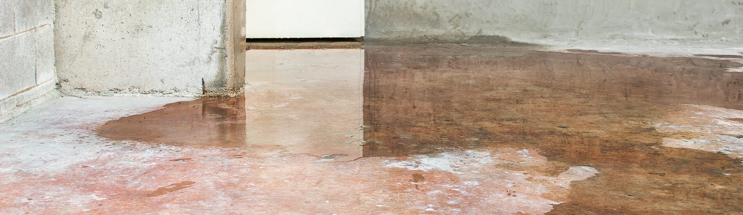 water spreading across a concrete floor