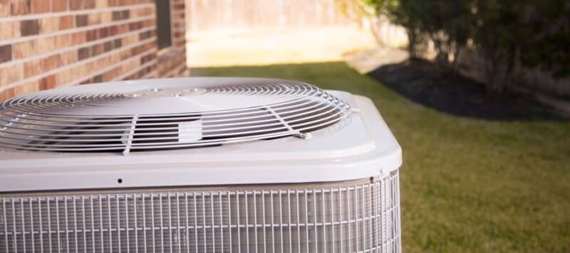 air conditioning set outside of an oklahoma home on a sunny day